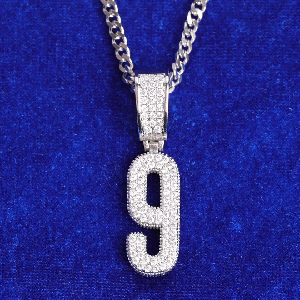 Image of silver iced number pendant. 