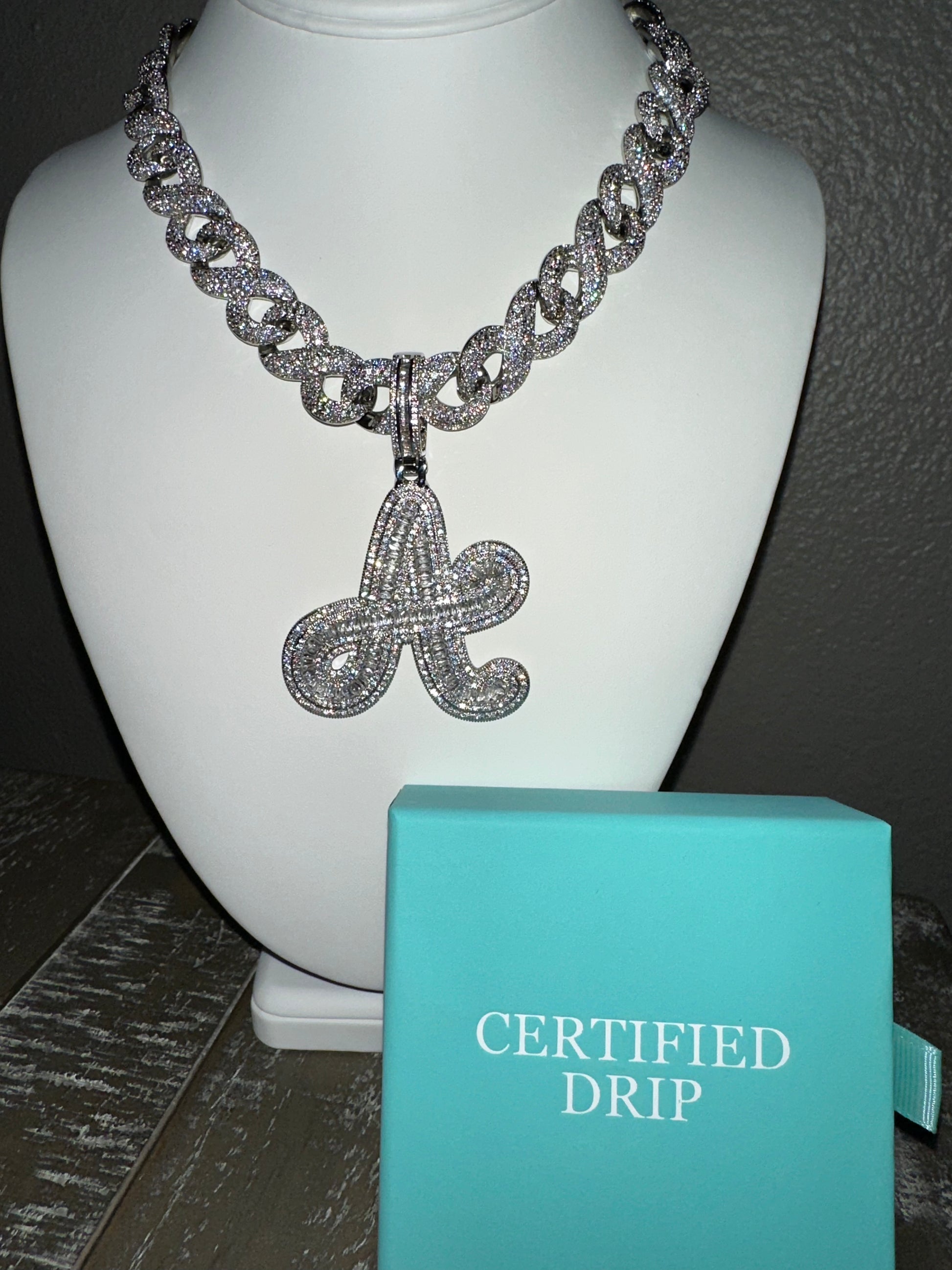 Image of silver Icy Baguette Cursive Initial X 15mm Cuban Chain Bundle.
